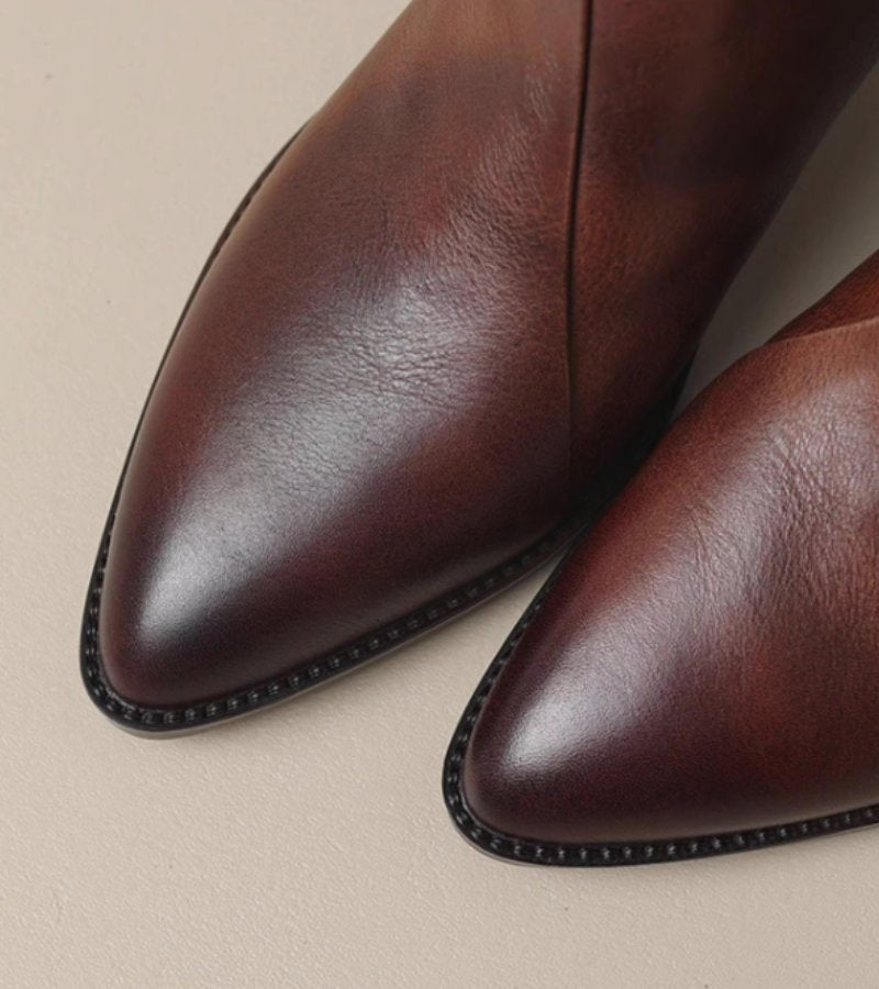 Women's pointed toe ankle boots with angled topline and block heel