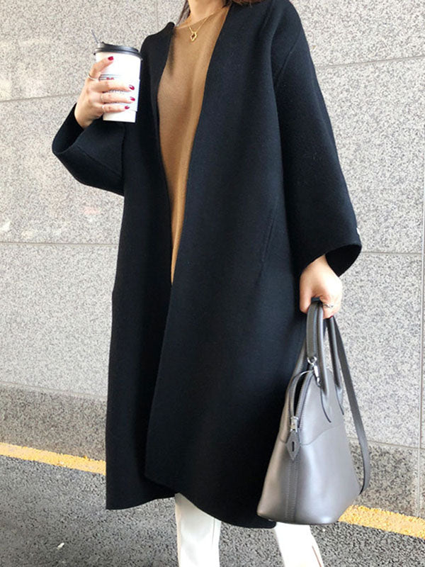 Women's collarless longline coat with open front and wide sleeves