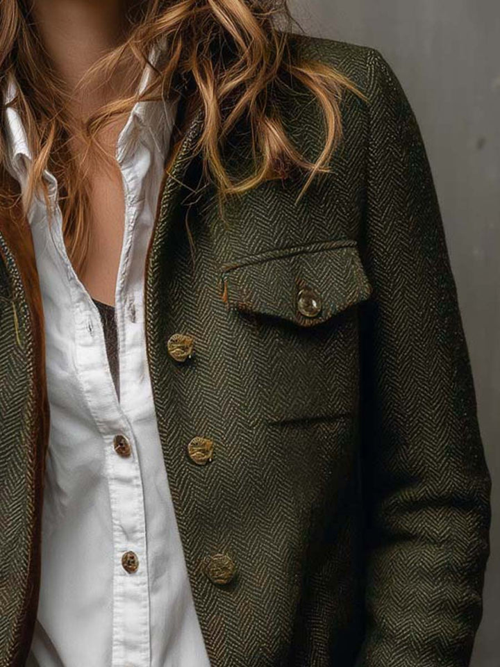 Women's green herringbone blazer with brown contrast trim and button front