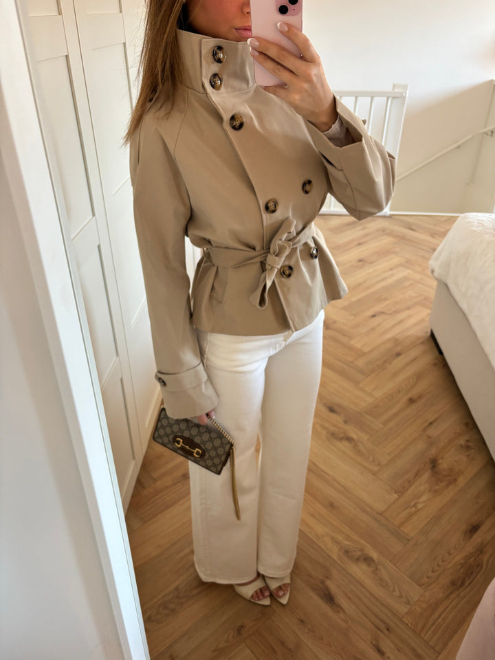 Women's beige belted trench jacket with high collar and button front