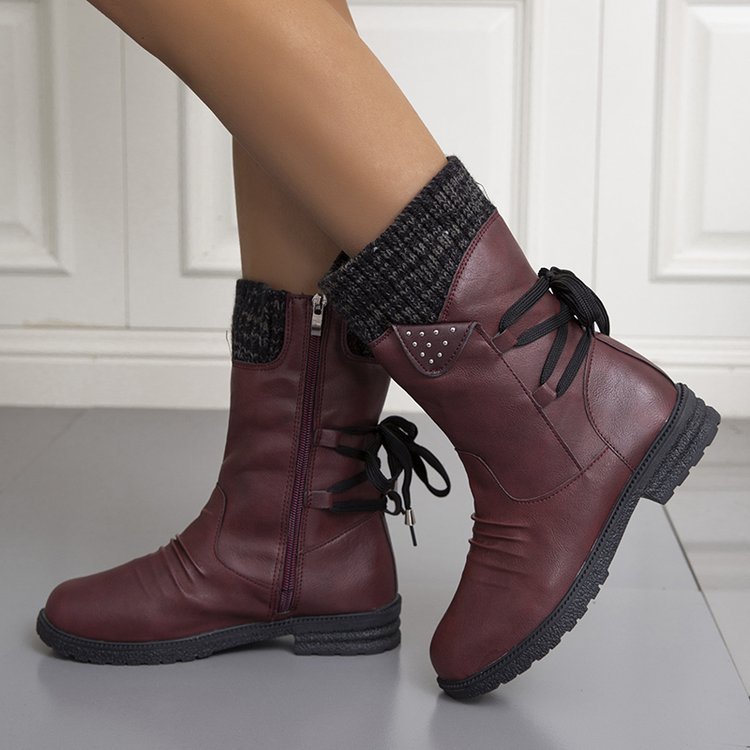 Women's winter boots with knitted cuffs, side zippers and lace-up details