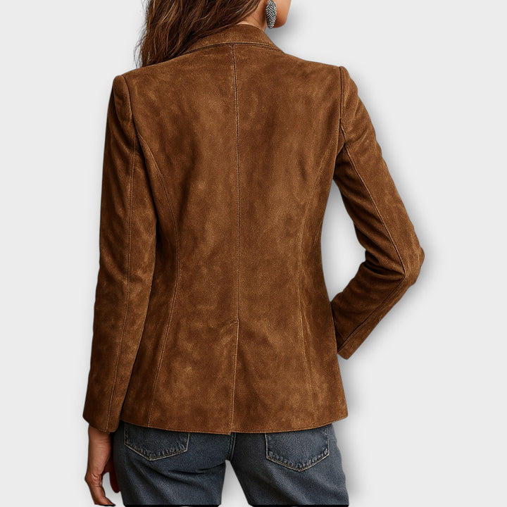 Women's vintage brown blazer with notched lapels, long sleeves, buttons and multiple pockets