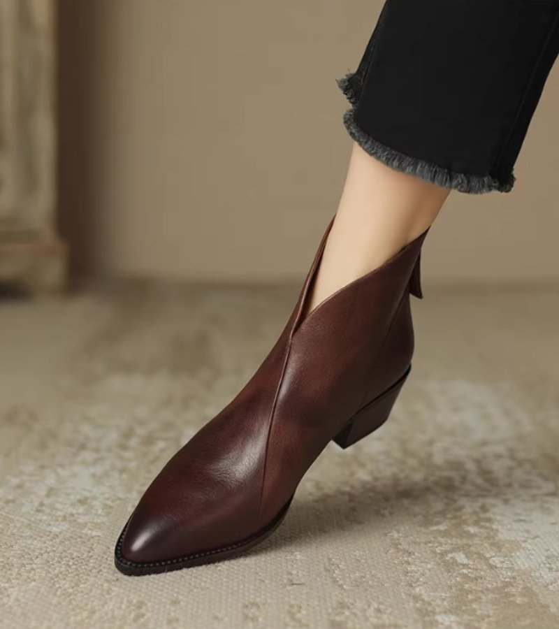 Women's pointed toe ankle boots with angled topline and block heel