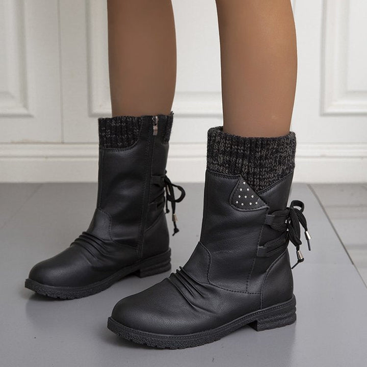 Women's winter boots with knitted cuffs, side zippers and lace-up details
