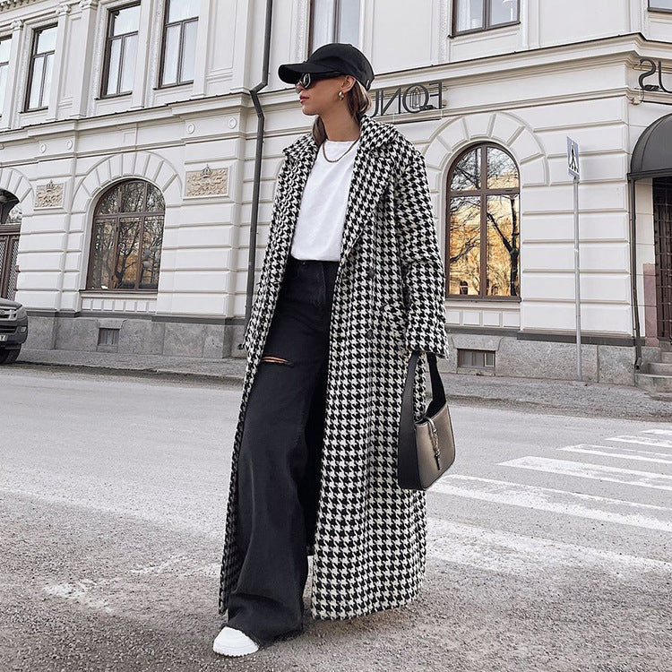 Women's black and white houndstooth long coat with lapel collar and button front