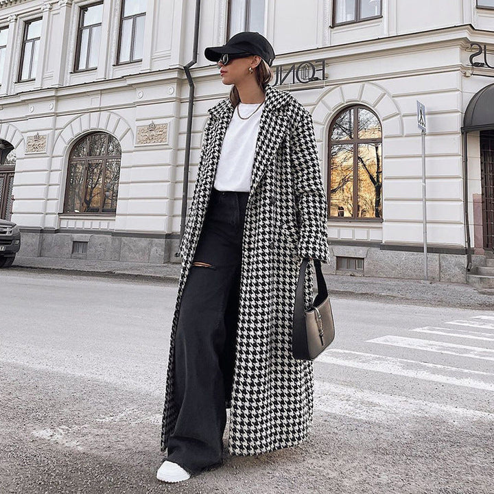 Women's black and white houndstooth long coat with lapel collar and button front