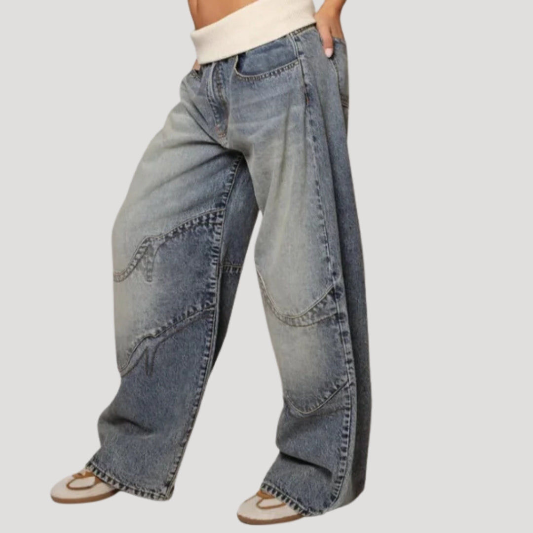 Women's light blue low-rise baggy jeans with wide legs and curved patchwork panels