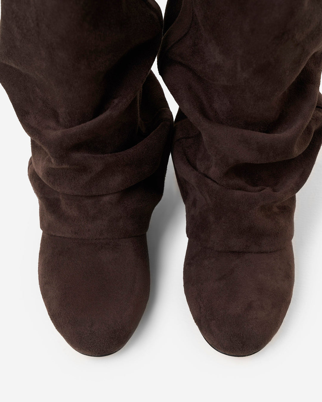 Women's dark brown slouchy knee-high boots with pointed toes and low heels