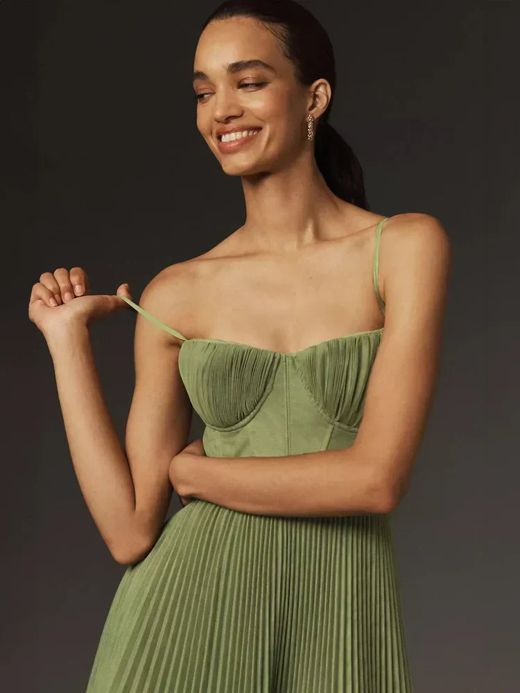 Women's olive green pleated midi dress with fitted corset bodice and spaghetti straps