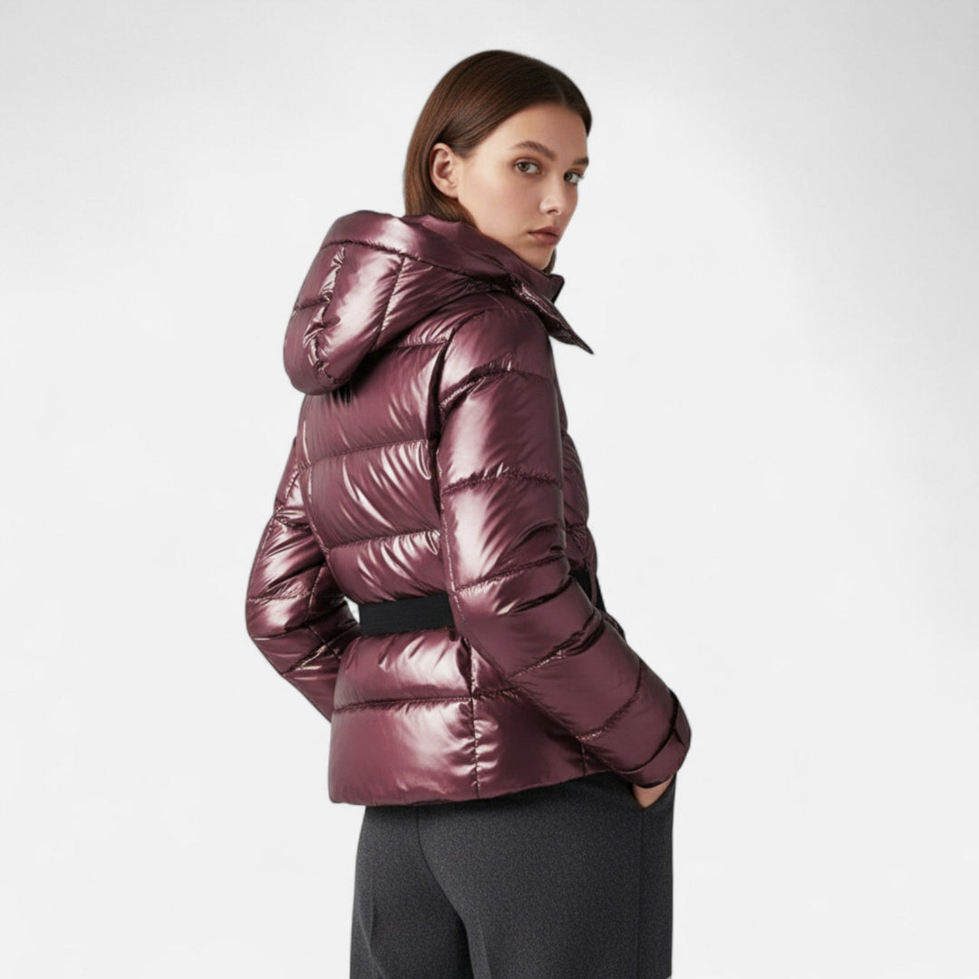 Women's hooded padded ski jacket with a belted waist and quilted panels