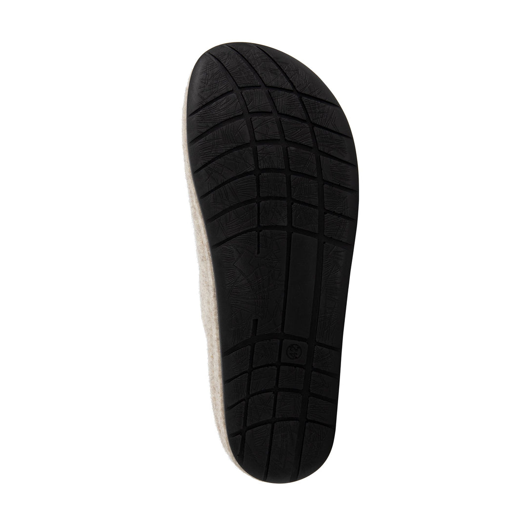 Beige closed-toe slip-on house slippers with black flat soles