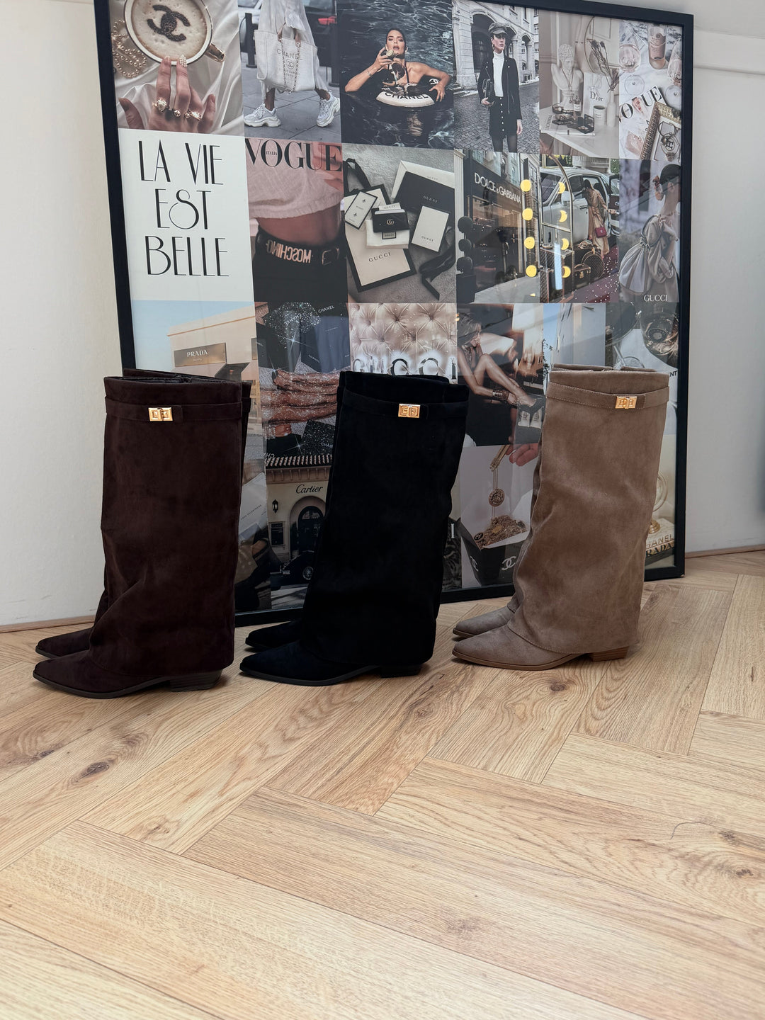 Women's beige knee-high boots with pointed toes, buckle straps and low block heels