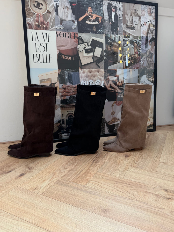 Women's beige knee-high boots with pointed toes, buckle straps and low block heels