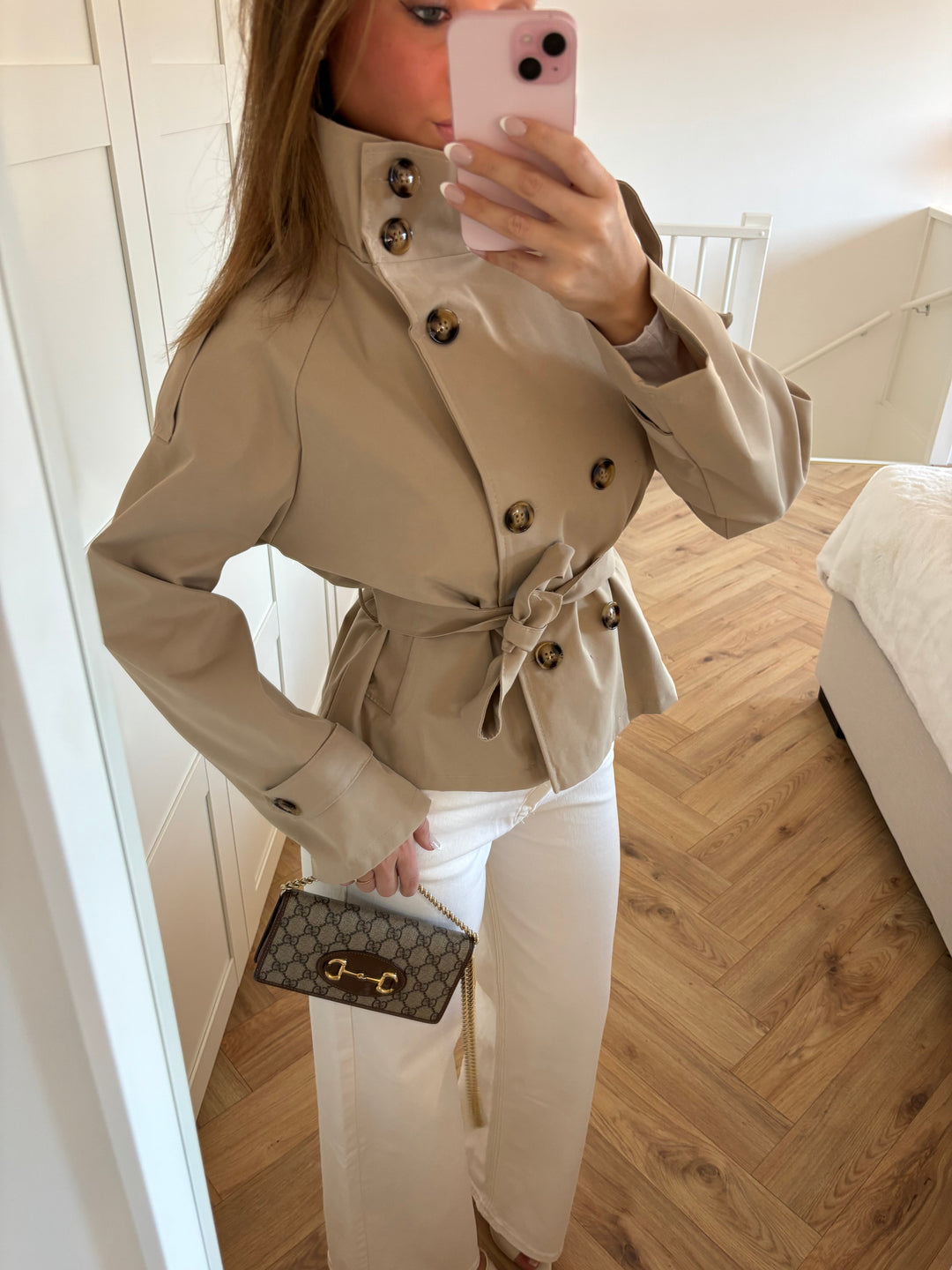 Women's beige belted trench jacket with high collar and button front
