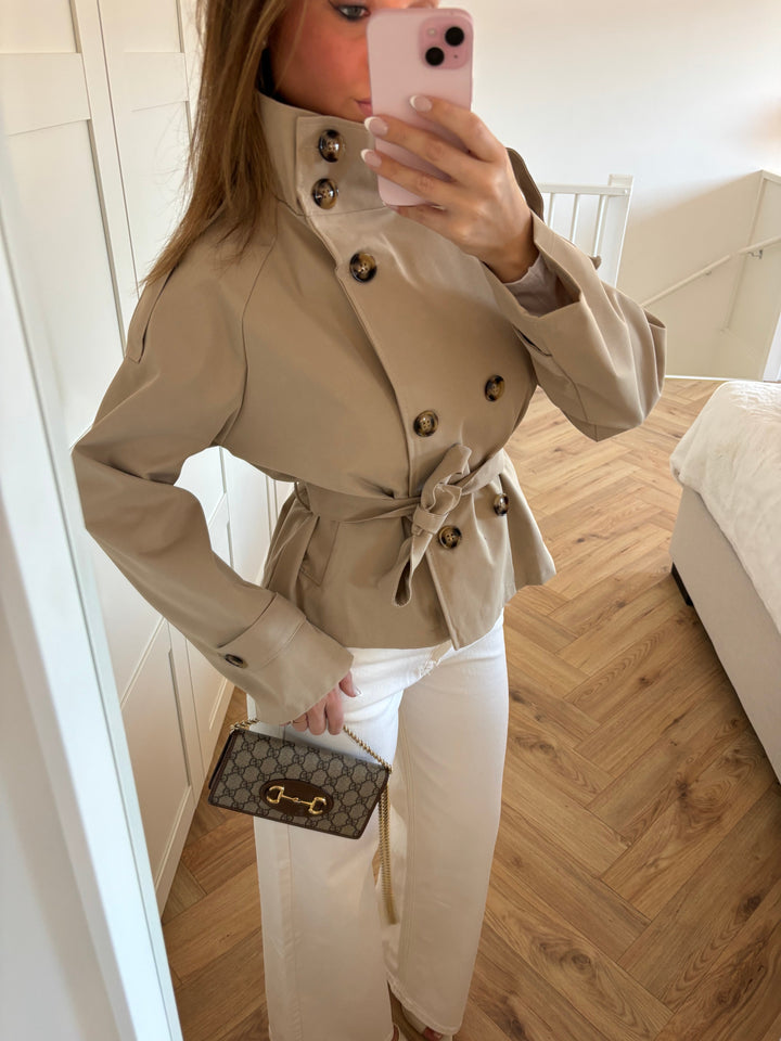 Women's beige belted trench jacket with high collar and button front