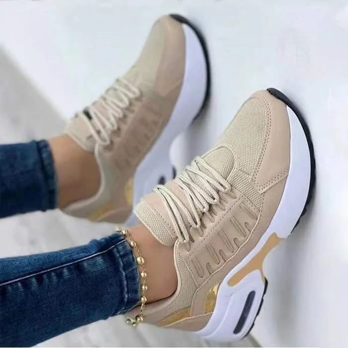 Women's low-top lace-up sneakers with layered panels and chunky sculpted soles