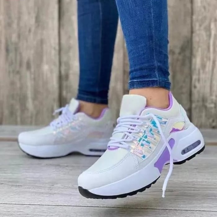 Women's low-top lace-up sneakers with layered panels and chunky sculpted soles