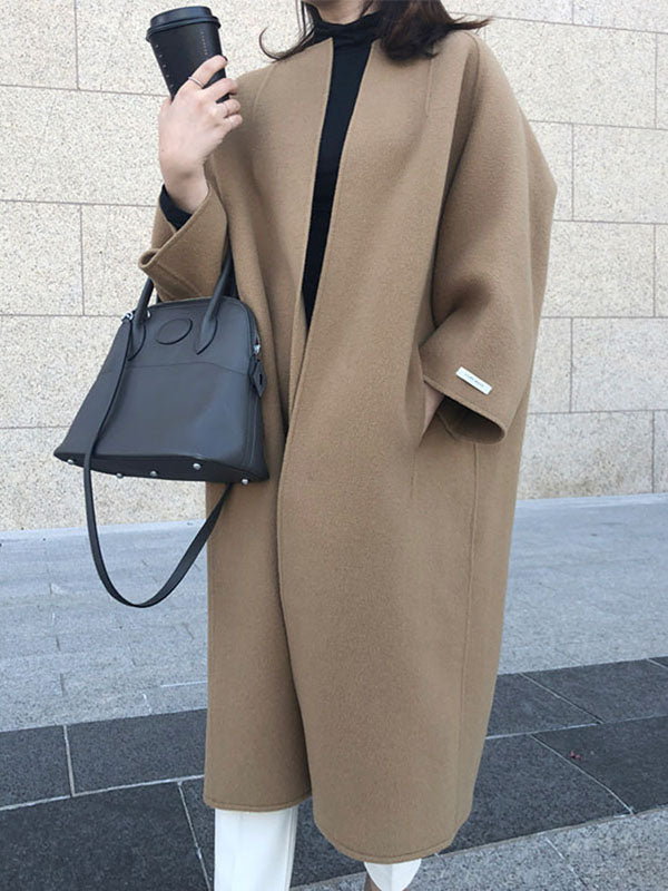 Women's collarless longline coat with open front and wide sleeves
