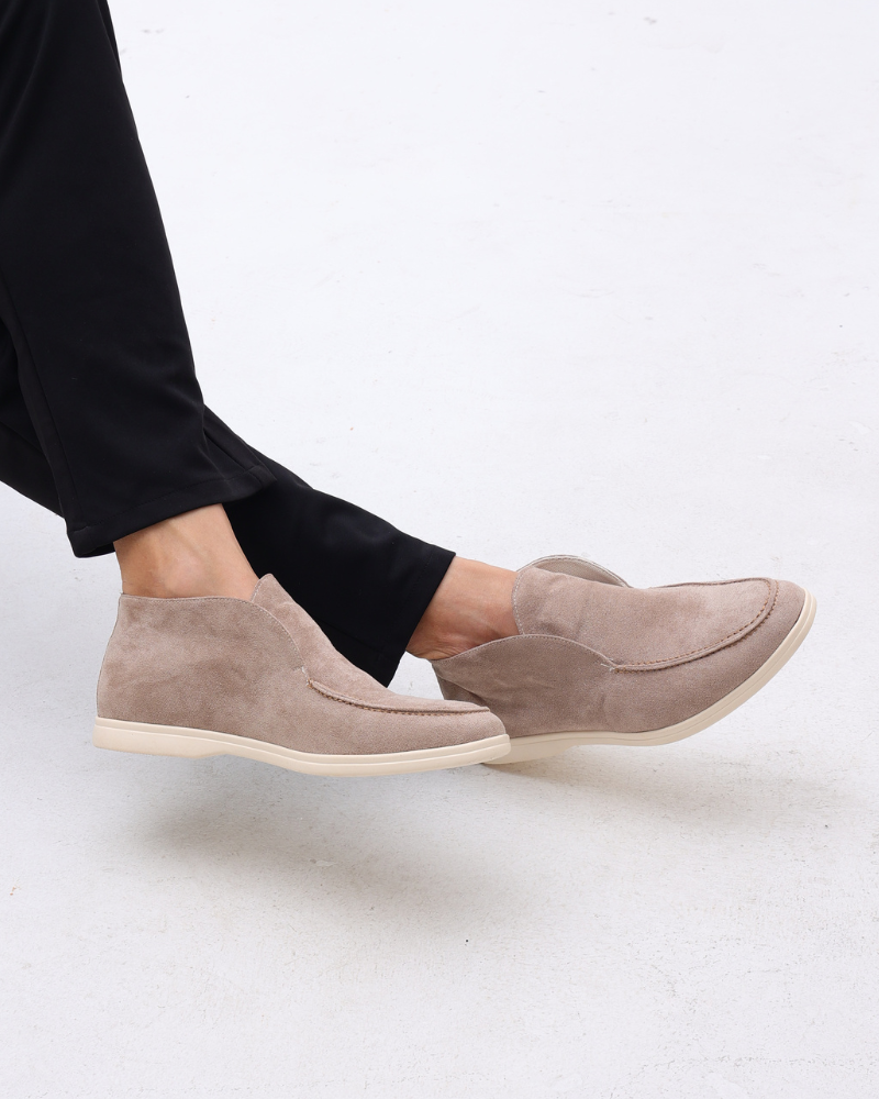 High-top slip-on loafers with rounded moc toes and flat light-coloured soles