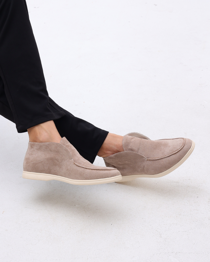 High-top slip-on loafers with rounded moc toes and flat light-coloured soles