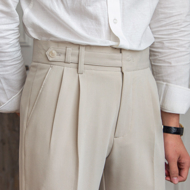 Women's high-rise pleated straight-leg trousers with belt loops and side pockets