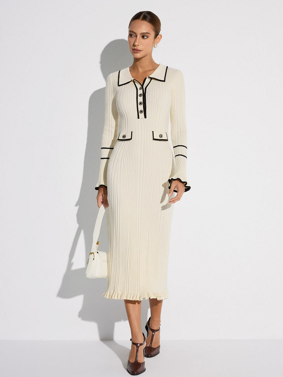 Women's off white ribbed midi sweater dress with black contrast trim, collar, buttons and long sleeves