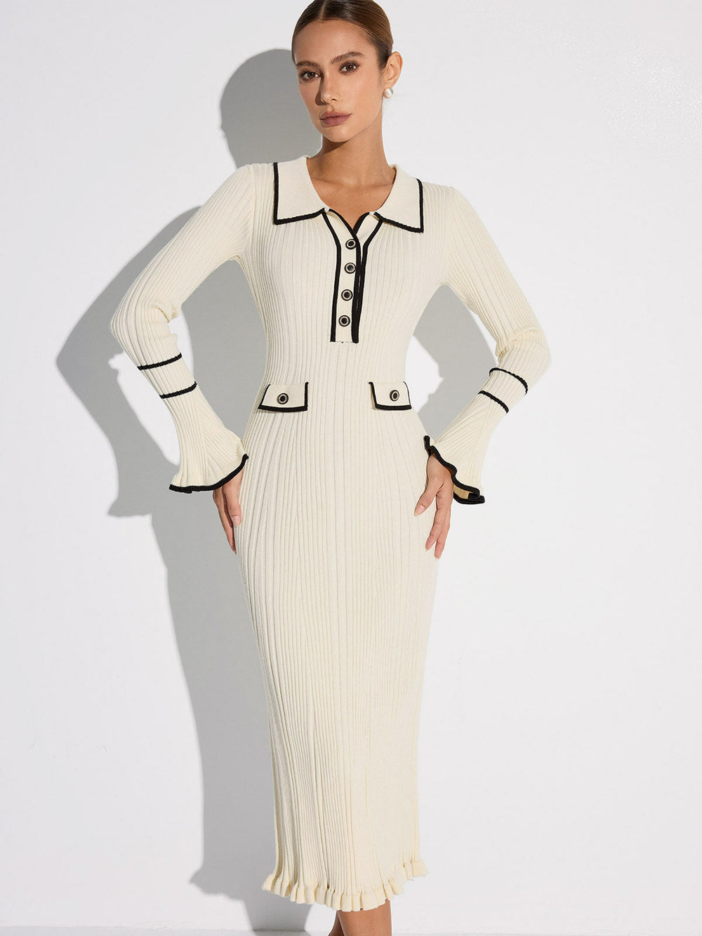 Women's off white ribbed midi sweater dress with black contrast trim, collar, buttons and long sleeves