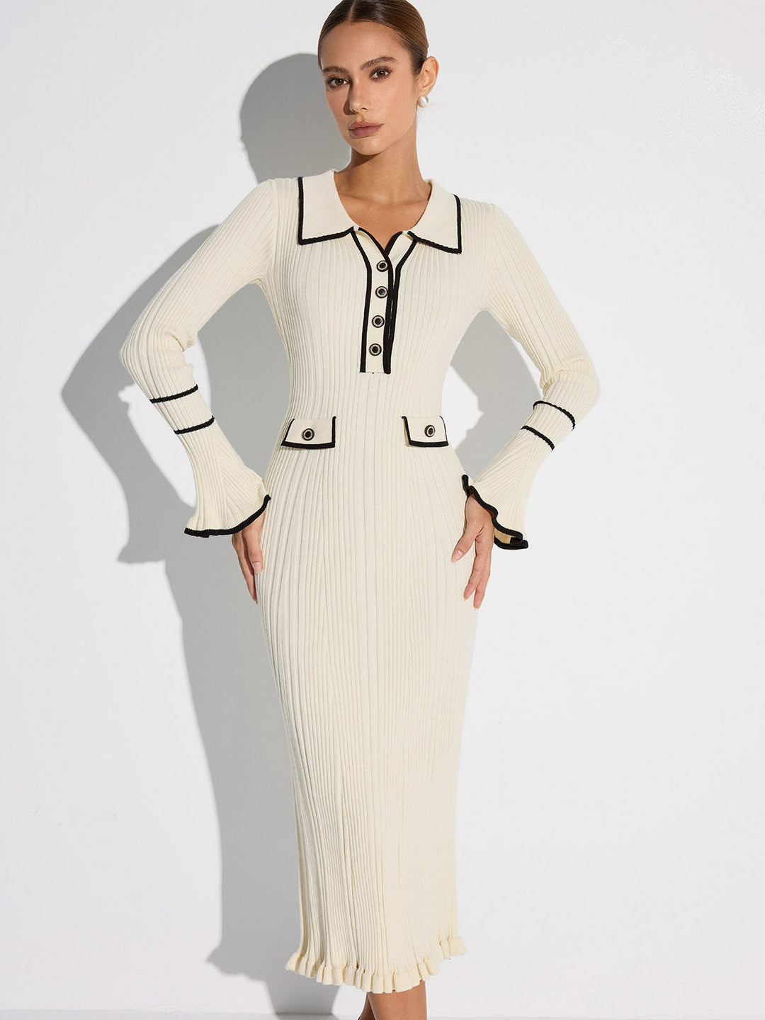Women's off white ribbed midi sweater dress with black contrast trim, collar, buttons and long sleeves