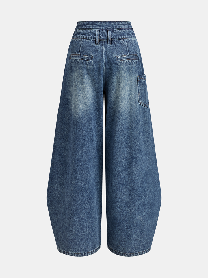 Women's blue wide-leg jeans with cross-front button waistband and utility pocket