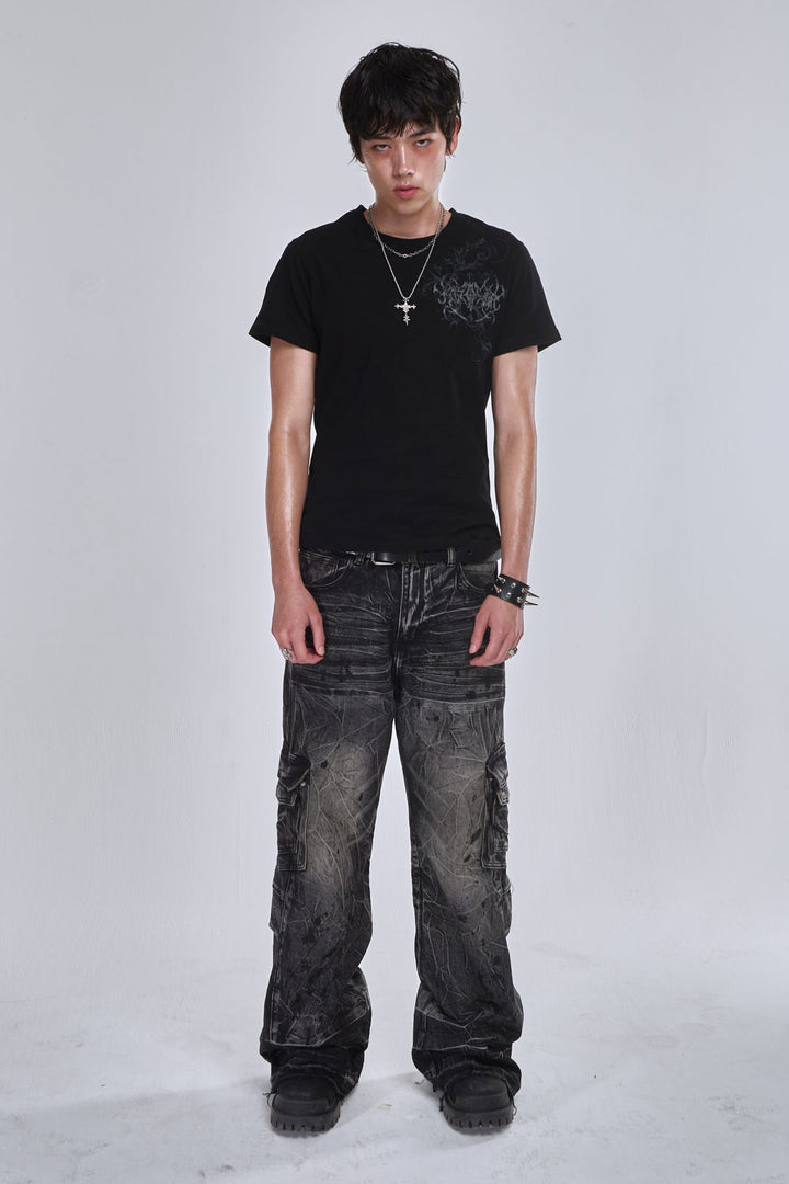Black wide-leg cargo jeans with fractured textured finish and multiple utility pockets