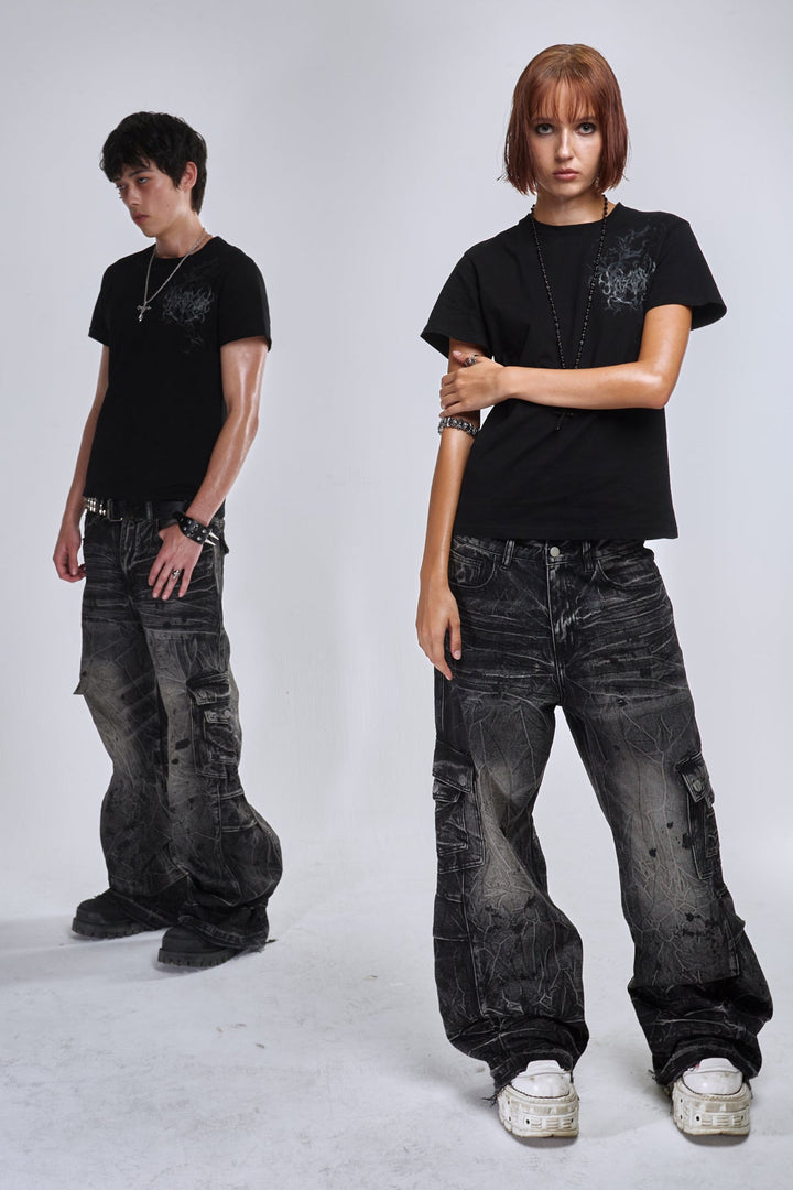 Black wide-leg cargo jeans with fractured textured finish and multiple utility pockets
