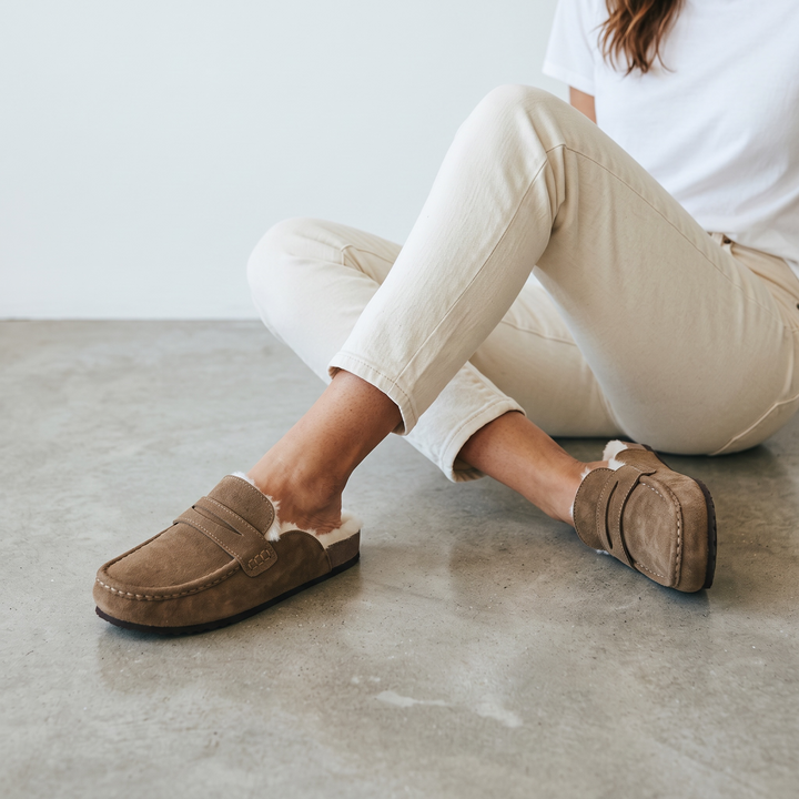 Women's brown lined loafer mule clogs with moc toe stitching and flat soles