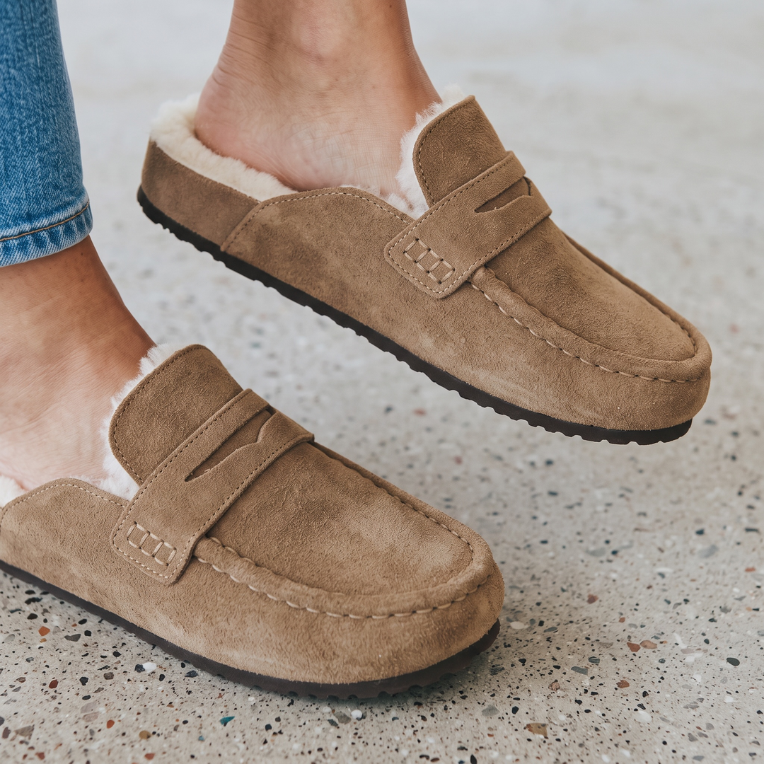 Women's brown lined loafer mule clogs with moc toe stitching and flat soles