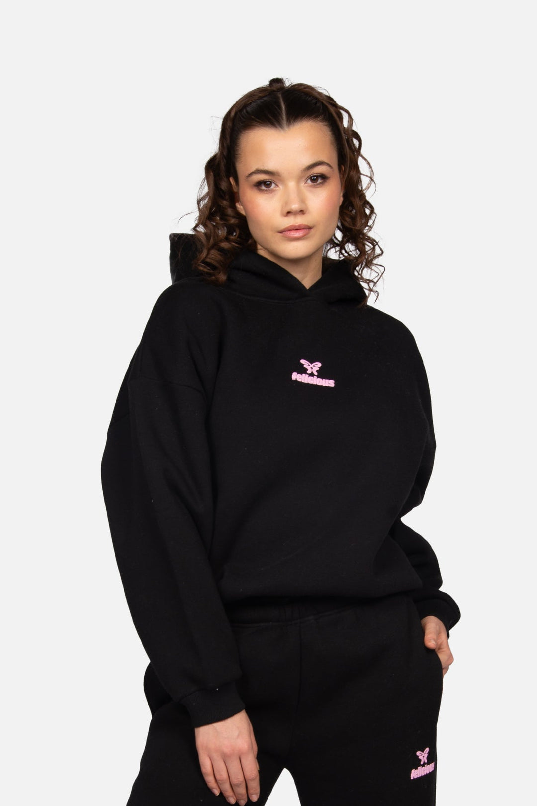 Women's black hooded sweatshirt with pink logo and ribbed trims