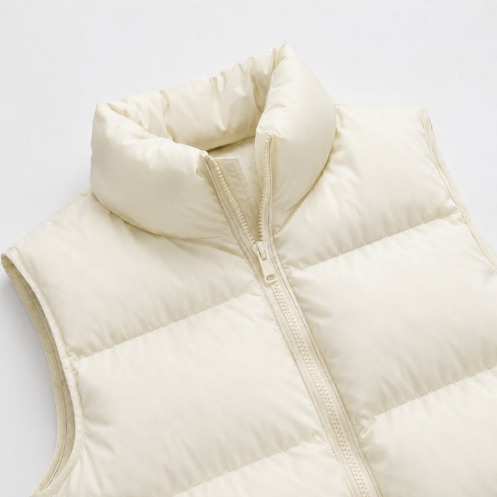 Women's cropped quilted puffer vest with mock neck and zip front