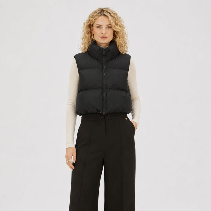 Women's cropped quilted puffer vest with mock neck and zip front