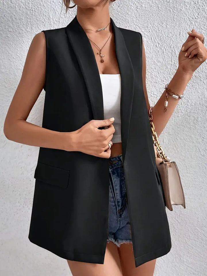 Women's black sleeveless longline blazer with lapel collar and flap pockets