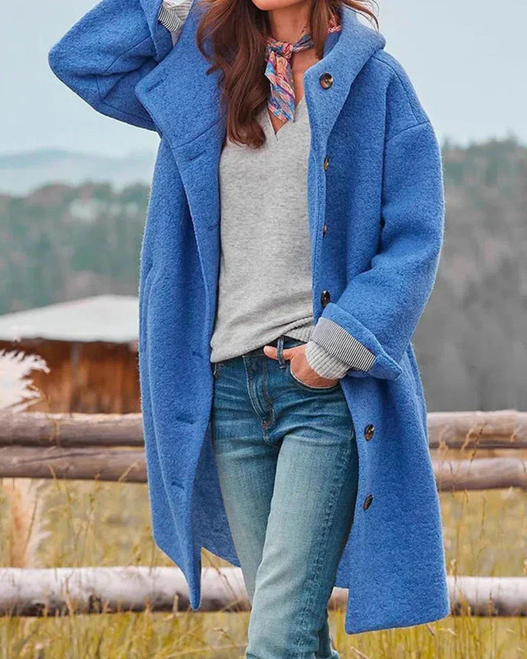 Women's long hooded button-front coat with flap pockets