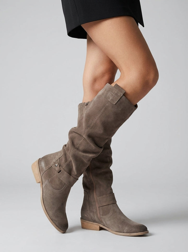 Women's knee-high boots with low block heels, side zippers and decorative straps