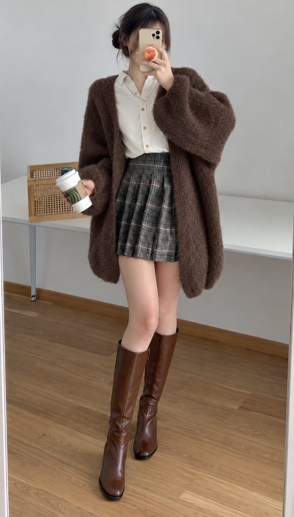 Woman wearing a longline open front cardigan with voluminous sleeves