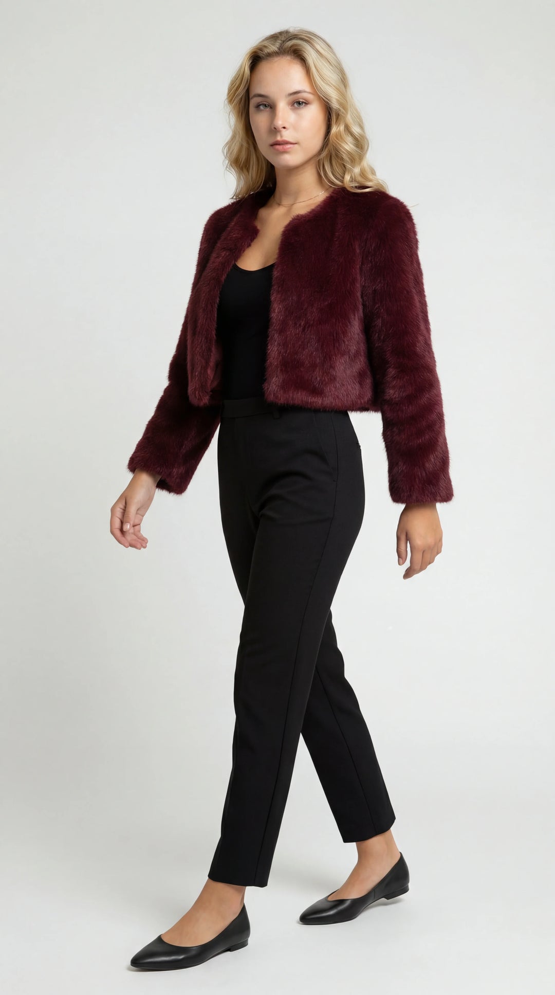 Women's cropped faux fur jacket with an open front and long sleeves