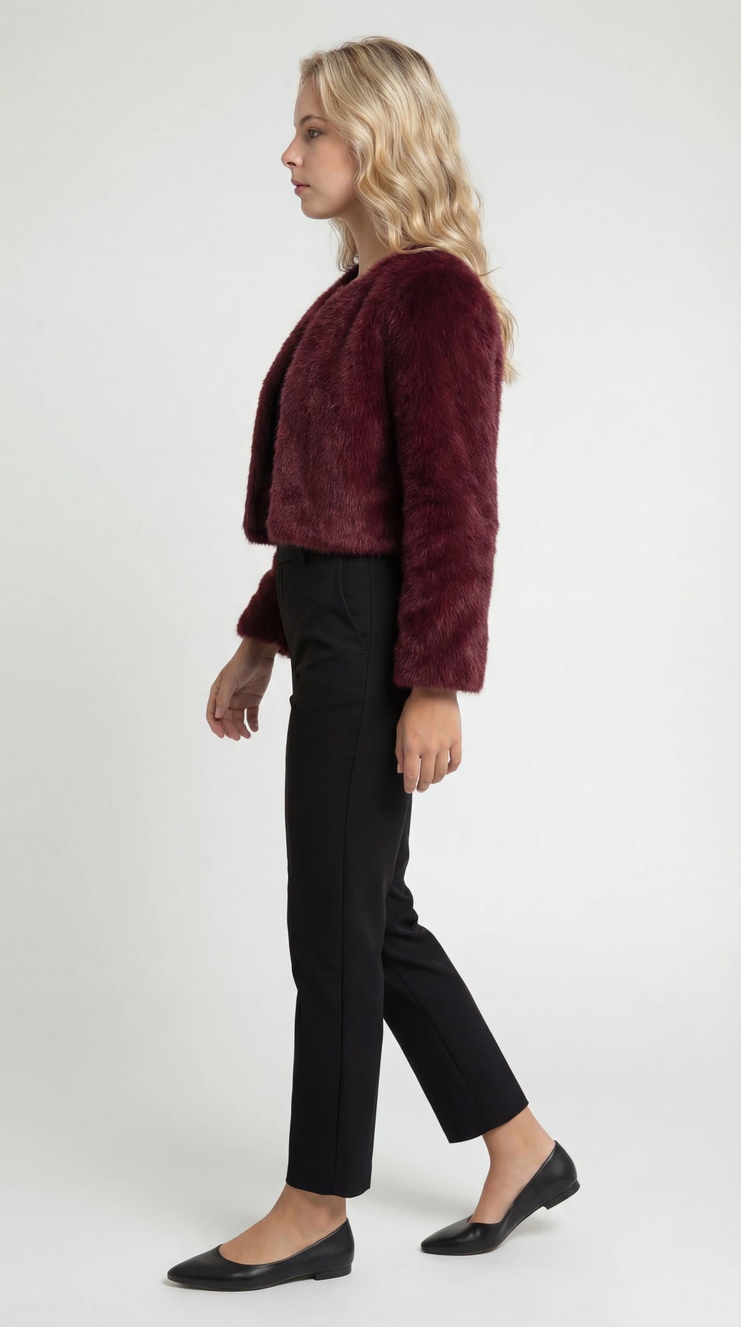 Women's cropped faux fur jacket with an open front and long sleeves