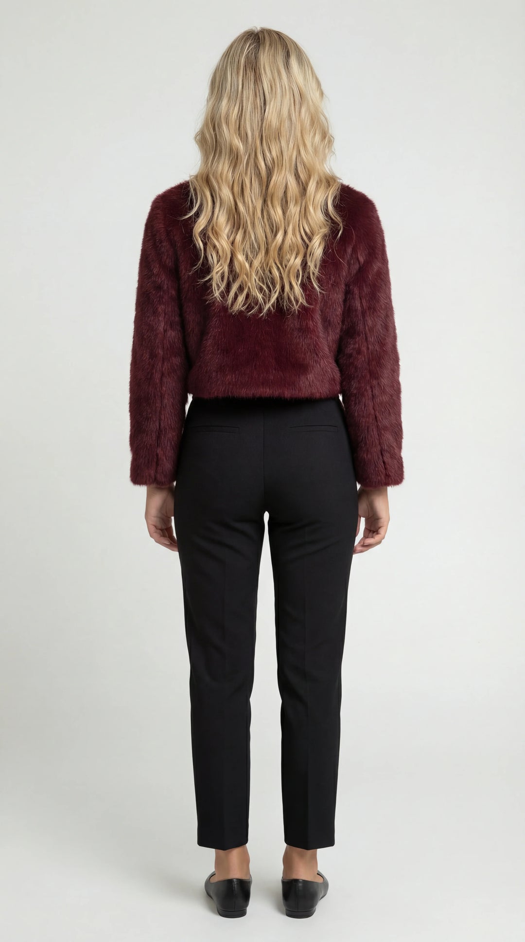 Women's cropped faux fur jacket with an open front and long sleeves