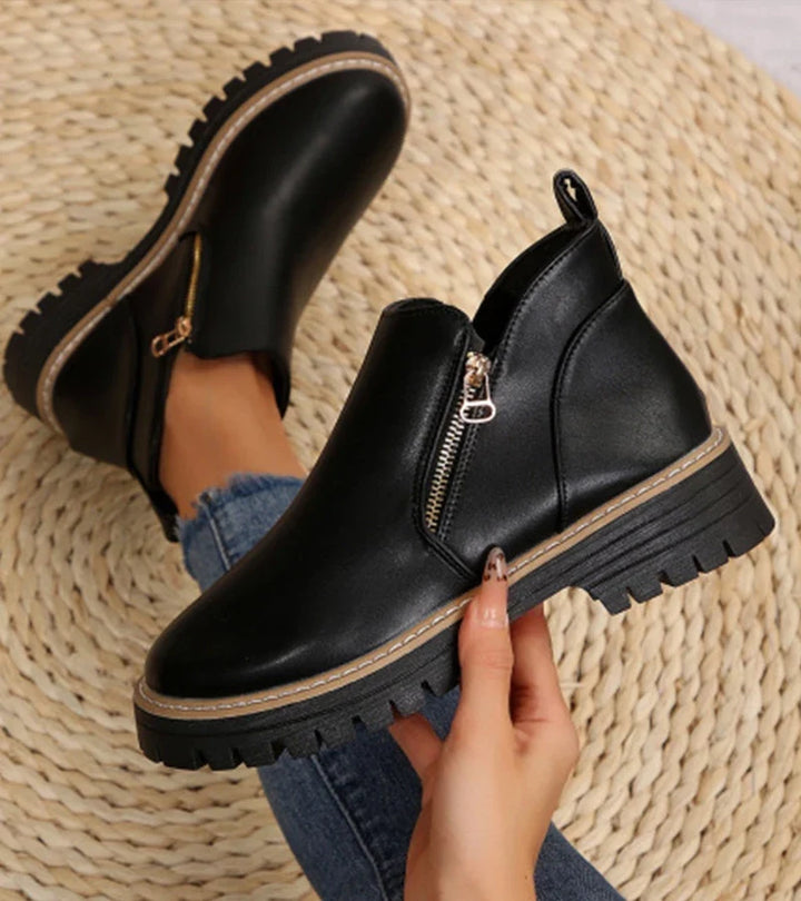 Women's ankle boots with side zippers and chunky lug soles