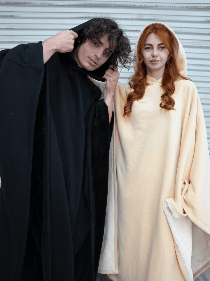 Oversized hooded cloak with plush faux fur lining and wide sleeves