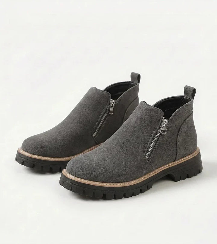 Women's ankle boots with side zippers and chunky lug soles