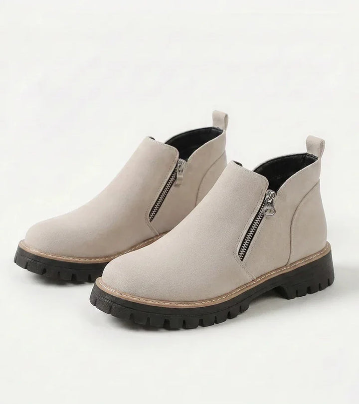Women's ankle boots with side zippers and chunky lug soles