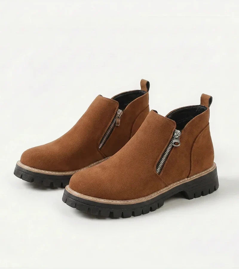 Women's ankle boots with side zippers and chunky lug soles