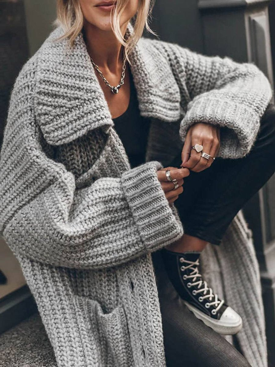 Women's oversized ribbed knit cardigan with shawl collar and button front