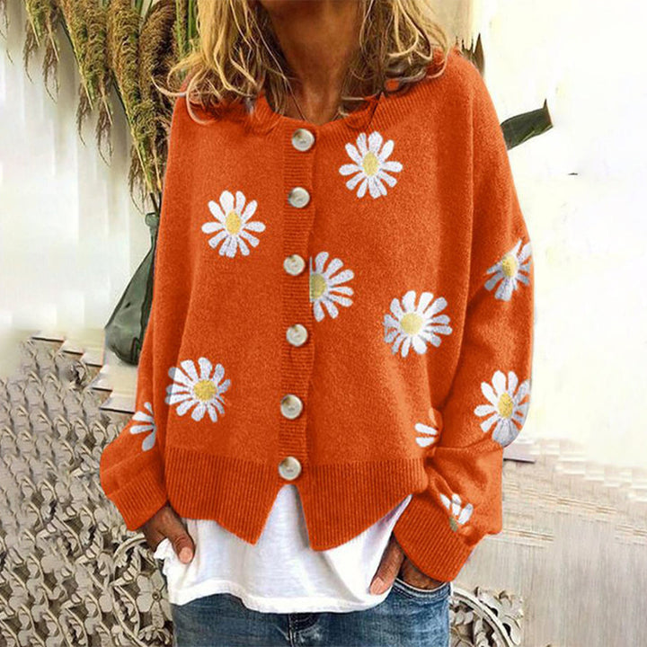 Women's floral knit cardigan with daisy motifs and button front